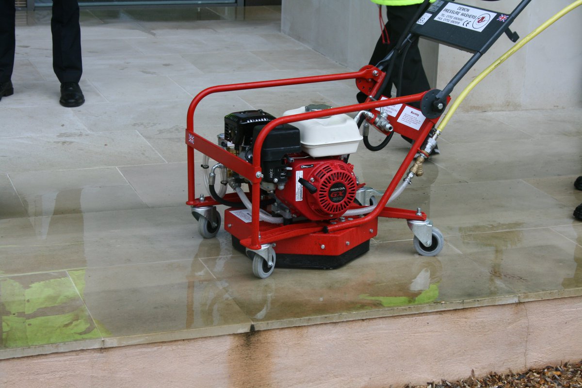Professional pressure washing equipment used by Moss Be Gone for driveway and patio cleaning