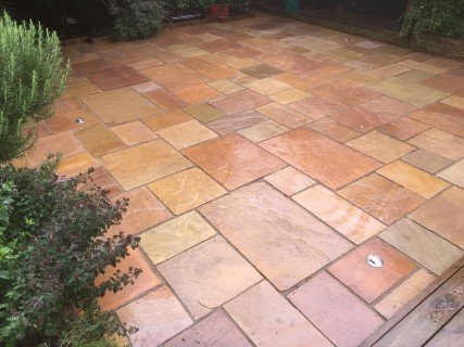 Restored garden patio after expert cleaning service in Newcastle and Cambridge